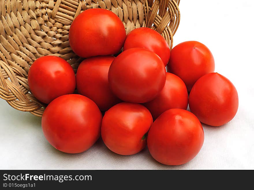 Red tomato and hand made wooden basket