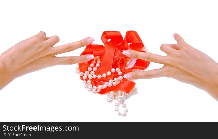 Woman`s hands with pearls