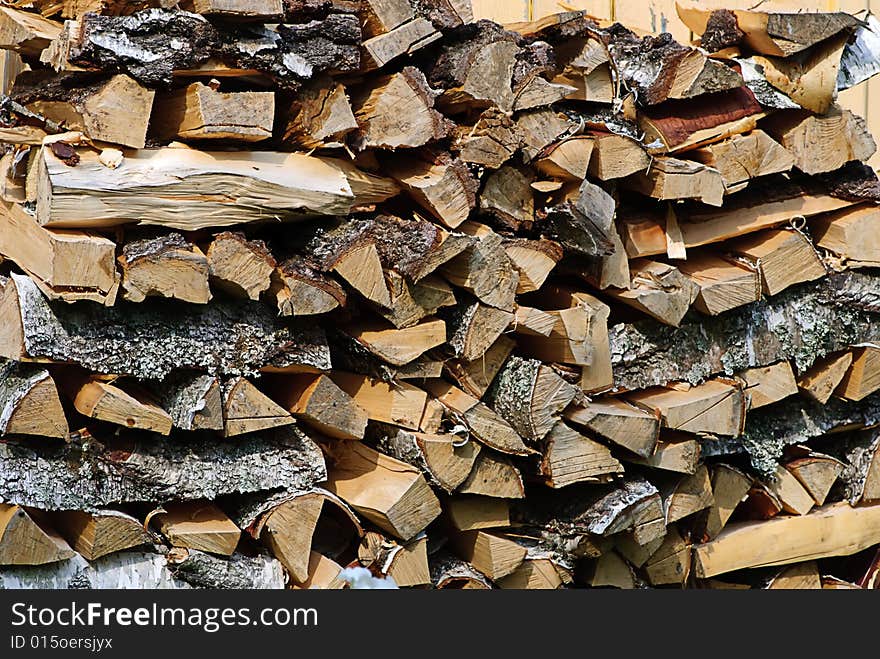 Stack of firewood birch in farm closeup. Stack of firewood birch in farm closeup