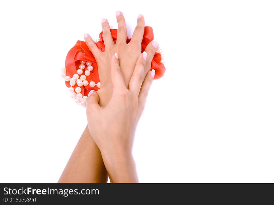 Woman`s hands with pearls