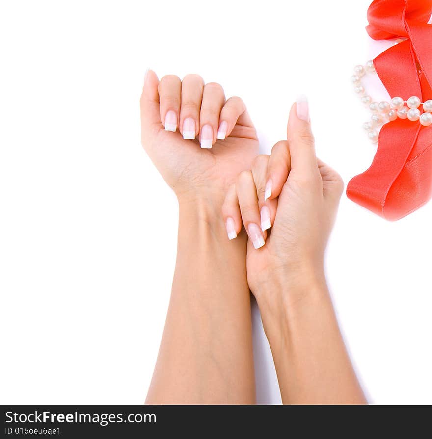 Woman`s hands with pearls