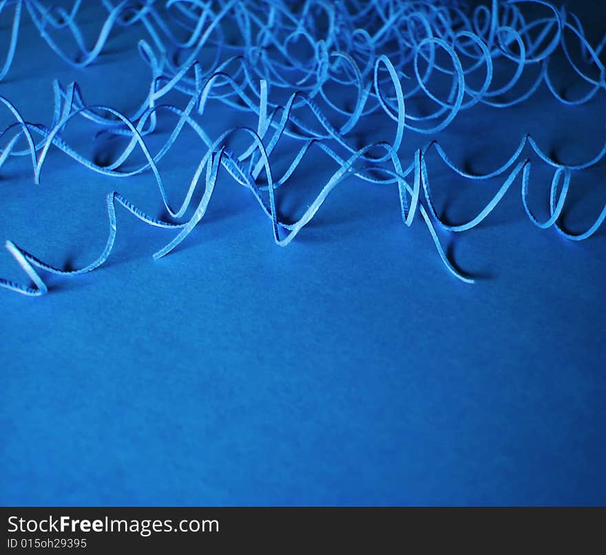 Blue background with paper curls