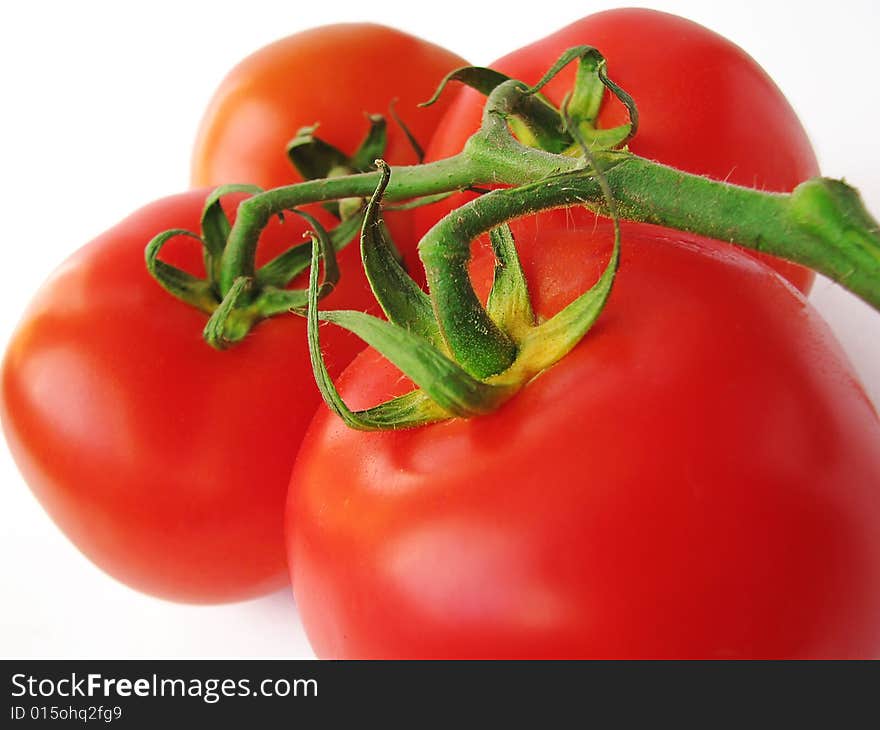 Red tomatoes isolated on white background