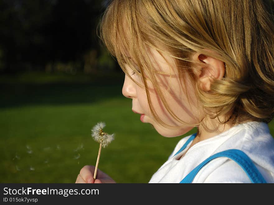 Girl Blowing Dandilion