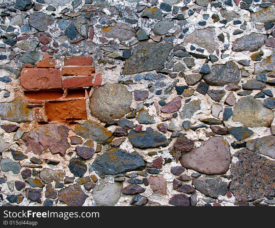 Old grey wall made of stones. Old grey wall made of stones