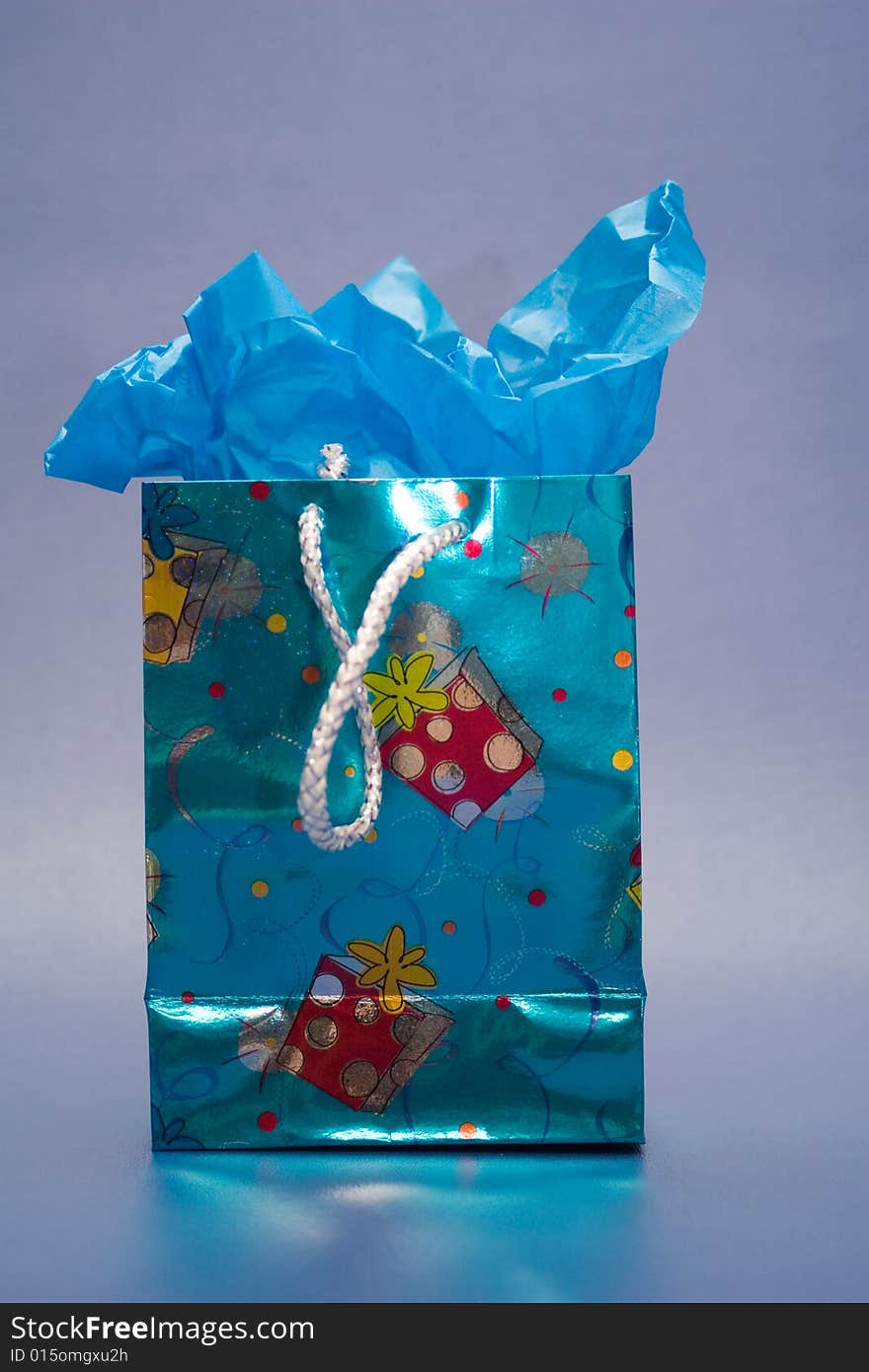 Blue gift bag with blue tissue paper.