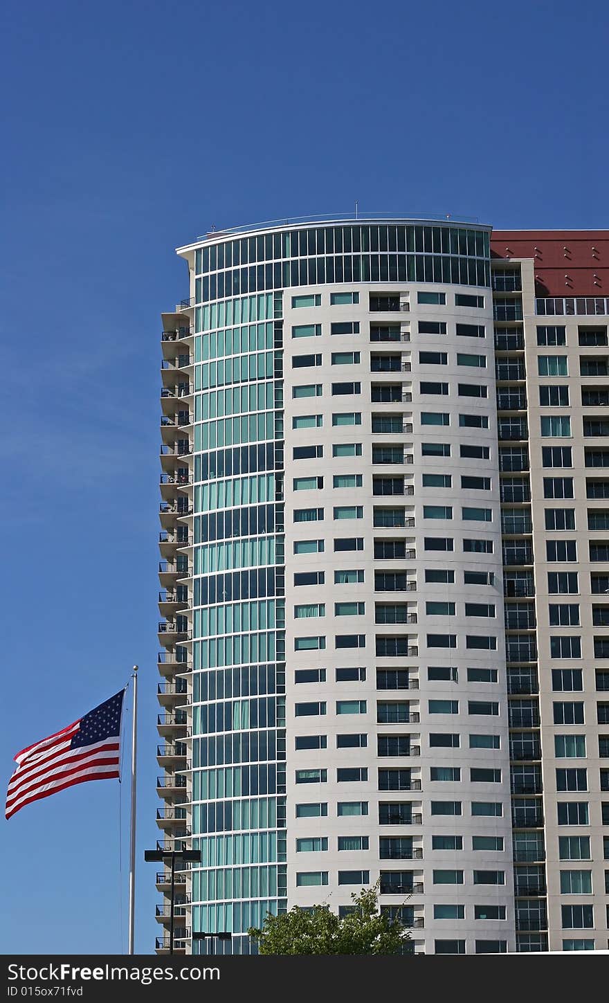 A high rise condo building an american flag. A high rise condo building an american flag