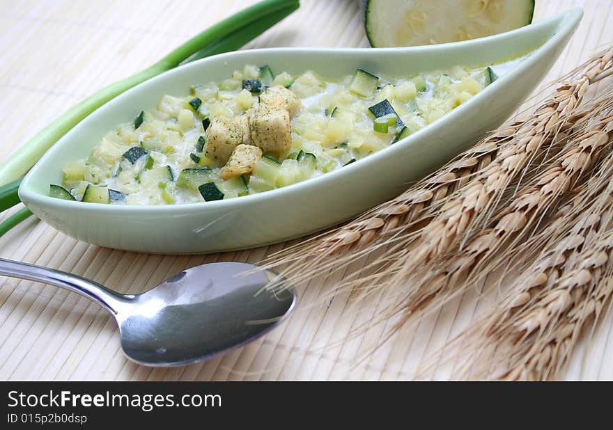 A fresh stew of zucchini with croutons