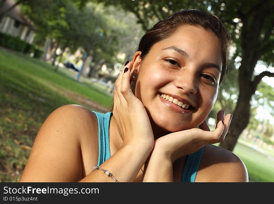 Young Girl Smiling In The Park