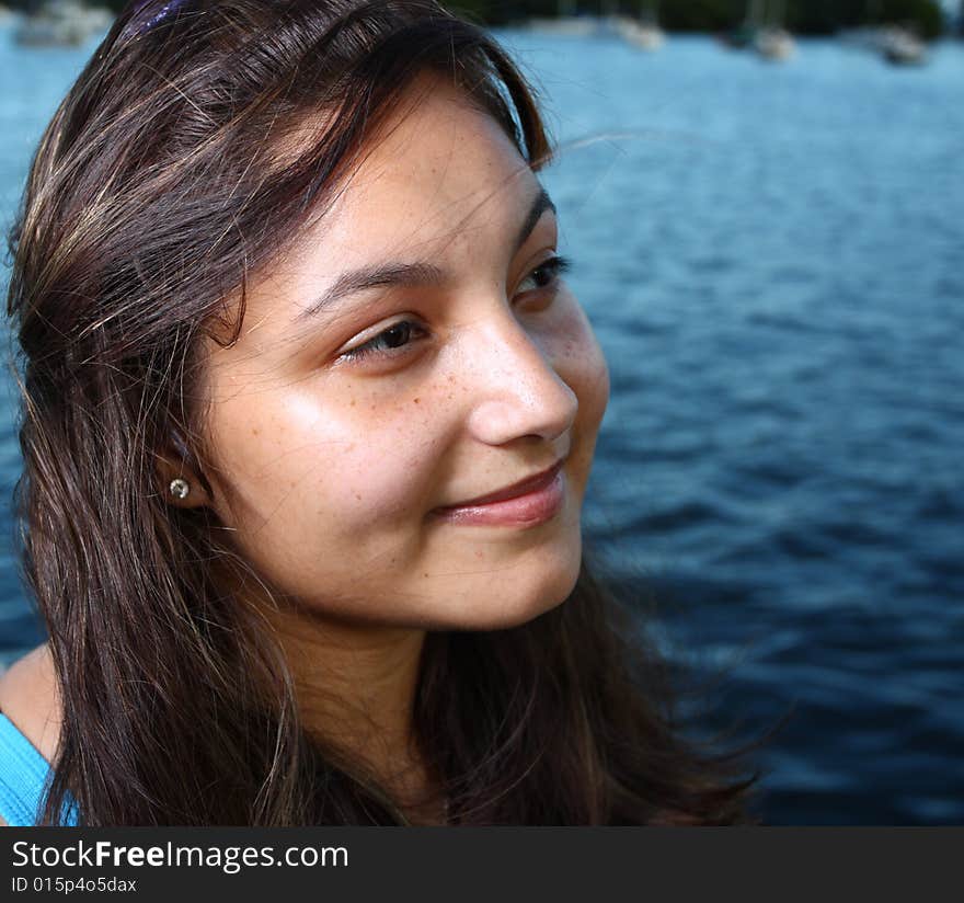 Young woman smiling while looking sideways