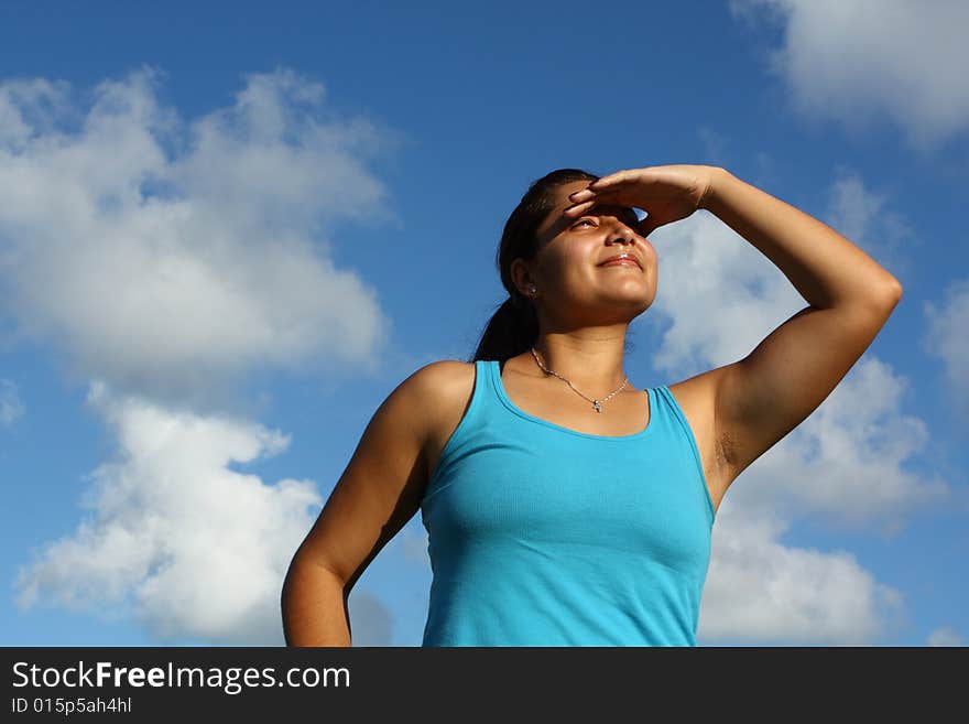 Young woman on a beautiful sky