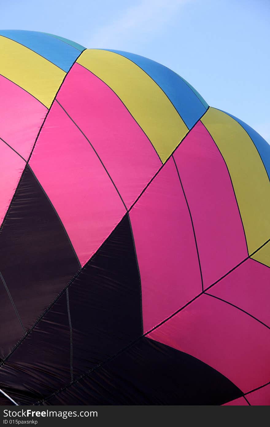 Closeup of a multi-colored hot air balloon being inflated