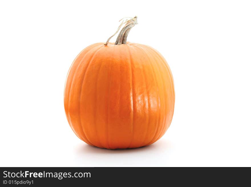 Big round orange pumpkin isolated on white