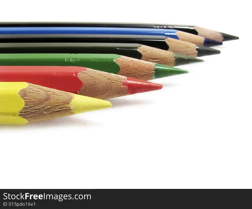 Closeup of color pencils in white background.