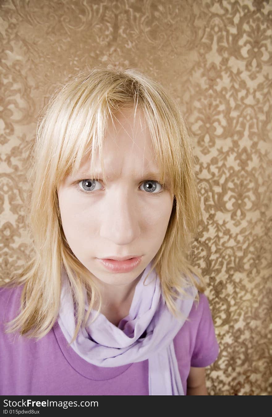 Cute young girl in purple showing annoyance. Cute young girl in purple showing annoyance