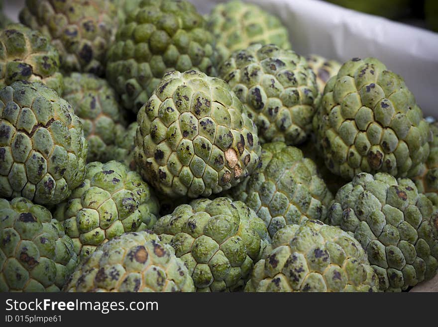 CUSTARD APPLE ON A BASKET, FAIR. CUSTARD APPLE ON A BASKET, FAIR