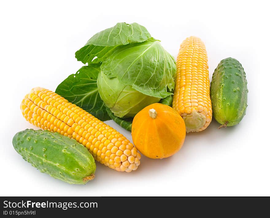 Ripe tasty and useful vegetables white background ears corn green cucumbers pumpkin cabbage