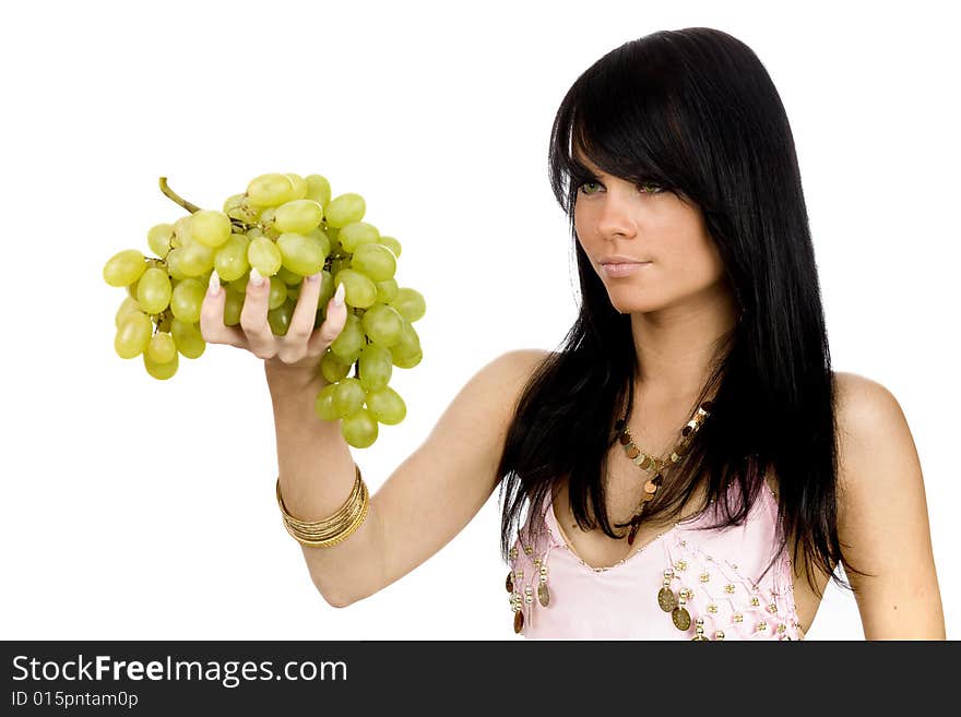 Young long hair brunette with bunch of black grapes. Young long hair brunette with bunch of black grapes