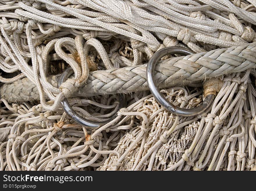 Close up of the lead rope of a comercial fishing net. Different size of netting