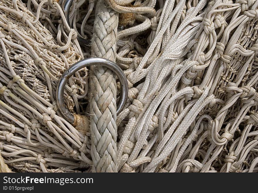 Close up of the lead rope of a comercial fishing net. Different size of netting