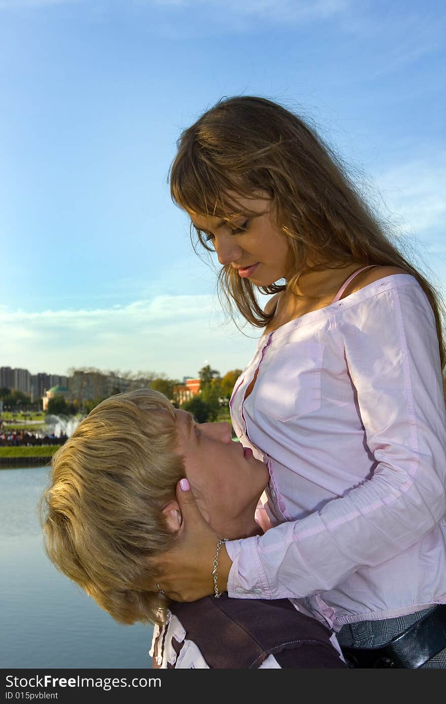 An attractive young woman embracing her handsome boyfriend. An attractive young woman embracing her handsome boyfriend