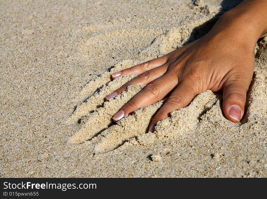 Hand to play in the sand. Hand to play in the sand