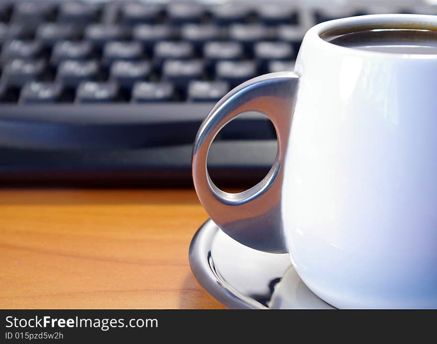 Cup Of Coffee And Black Keyboard