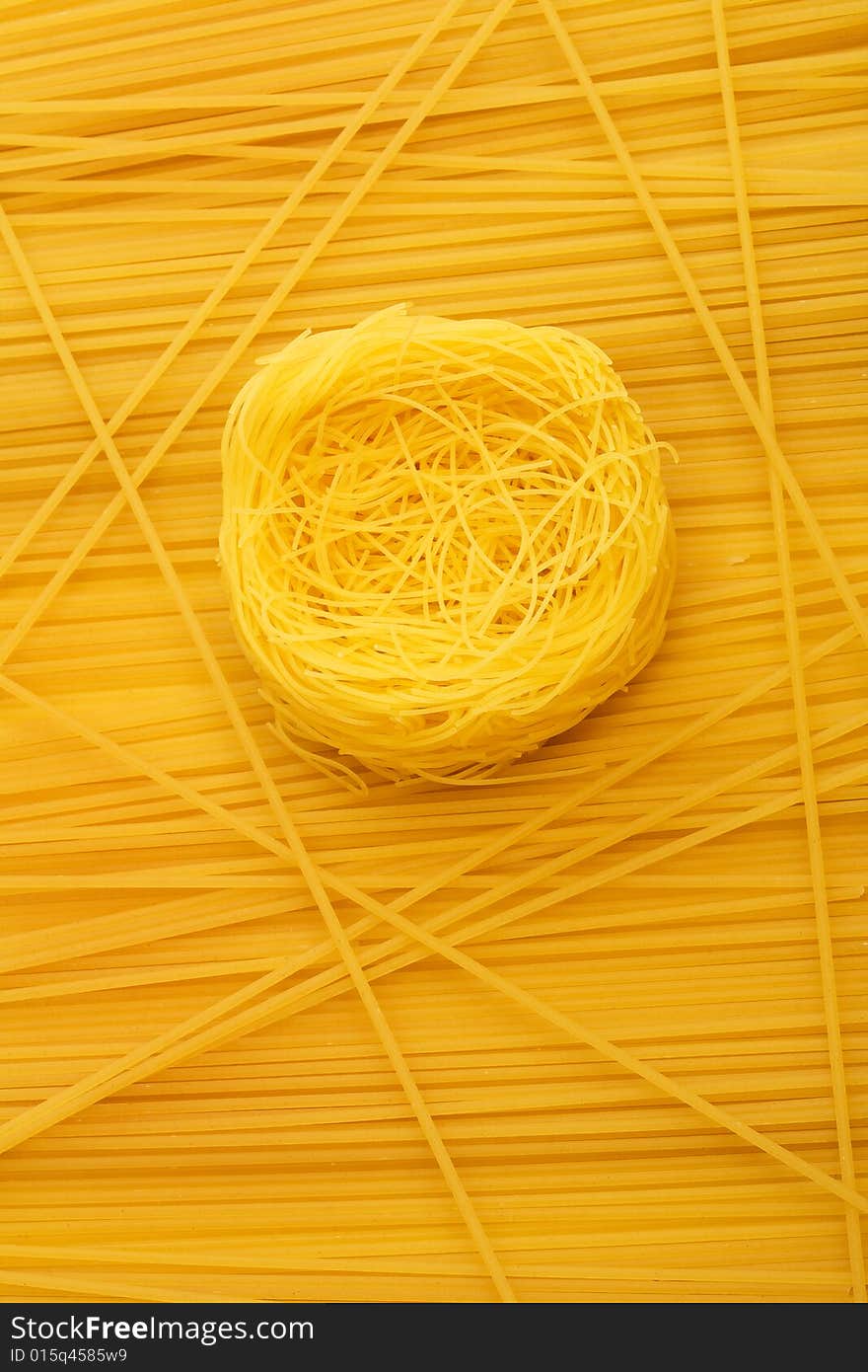 The twirls paste on a background of direct spaghettis. The twirls paste on a background of direct spaghettis