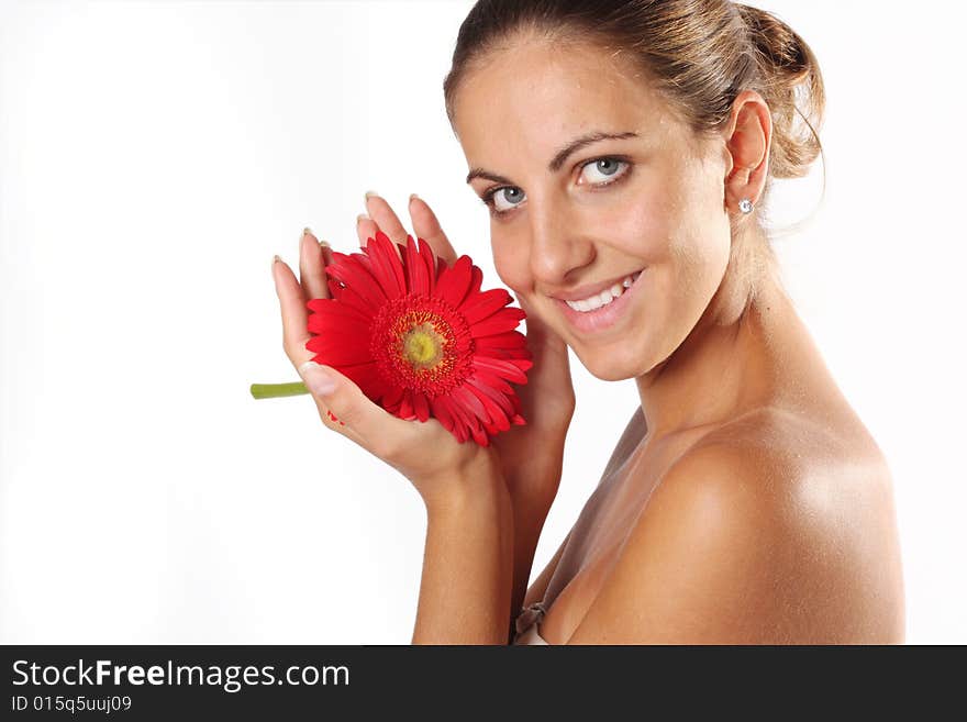 Beautiful woman with flower isolated on white