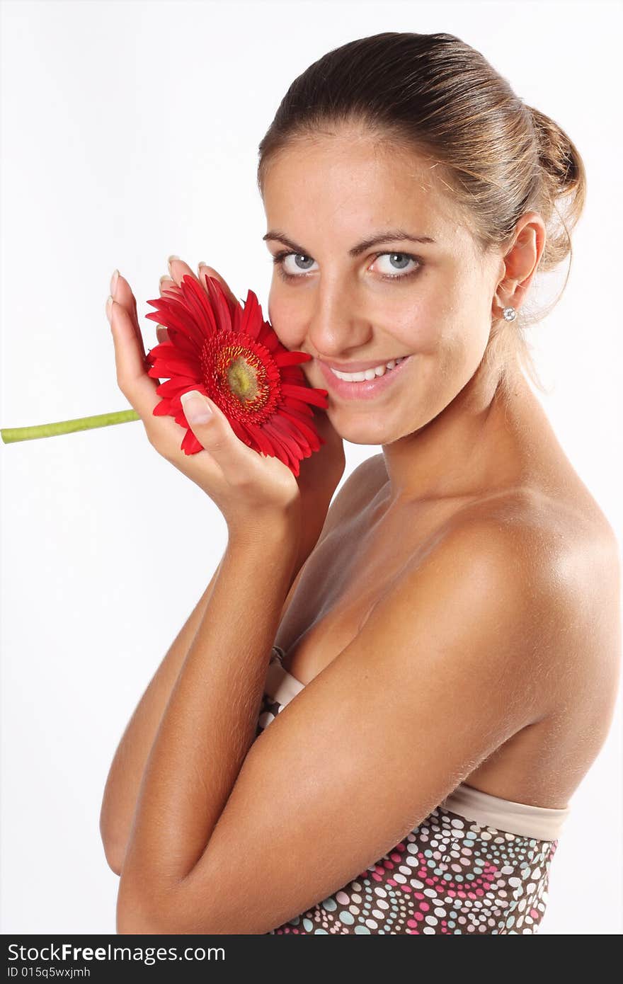 Beautiful woman with flower isolated on white