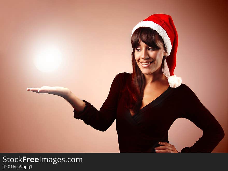 Portrait of woman wearing santa claus hat on red. Portrait of woman wearing santa claus hat on red