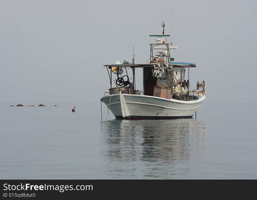 Fishermen s boat in calm