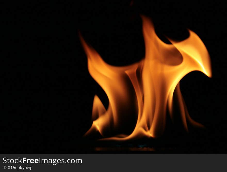 Flame isolated against a black background. Flame isolated against a black background