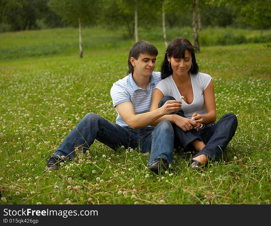 Rest of a happy loving couple in park. Rest of a happy loving couple in park