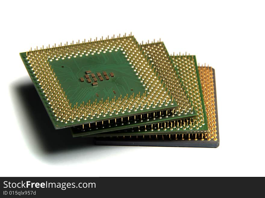 CPU in stack, close-up photo of computer hardware on white background