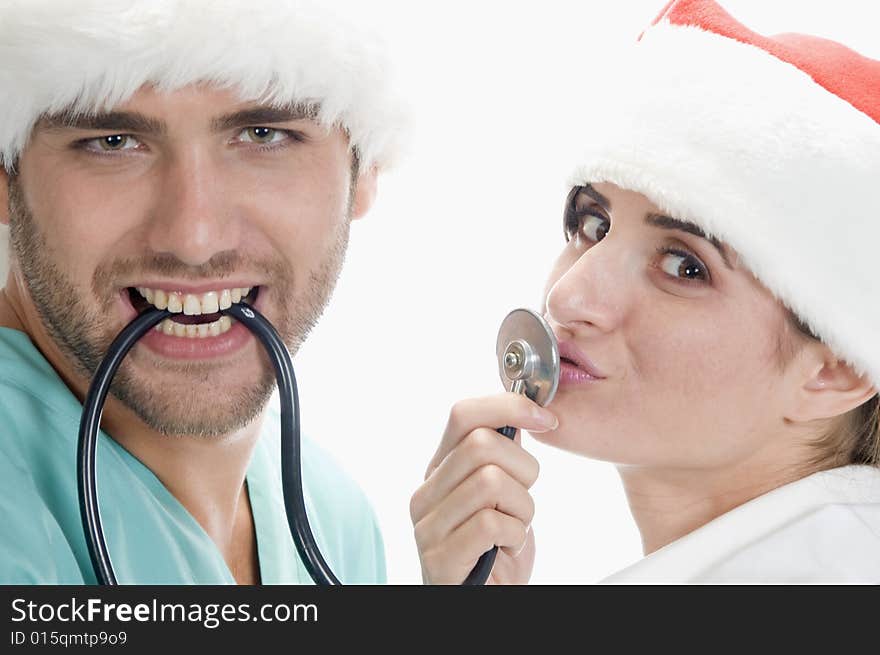 Medical professionals with stethoscope against white background