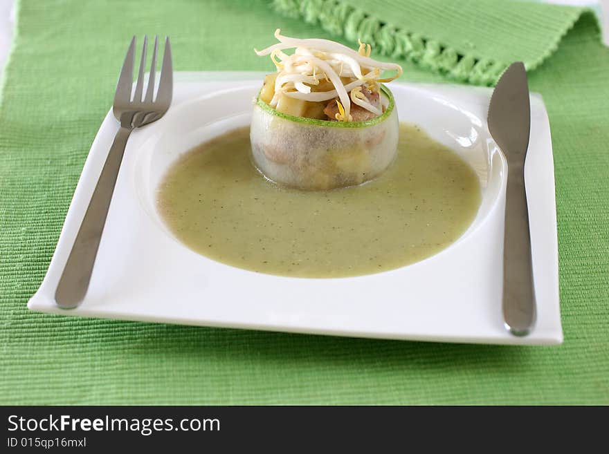 Green cucumber dish topped with mung bean sprouts. Green cucumber dish topped with mung bean sprouts