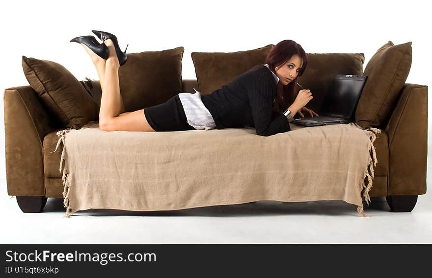 Lady Lying Working On Couch