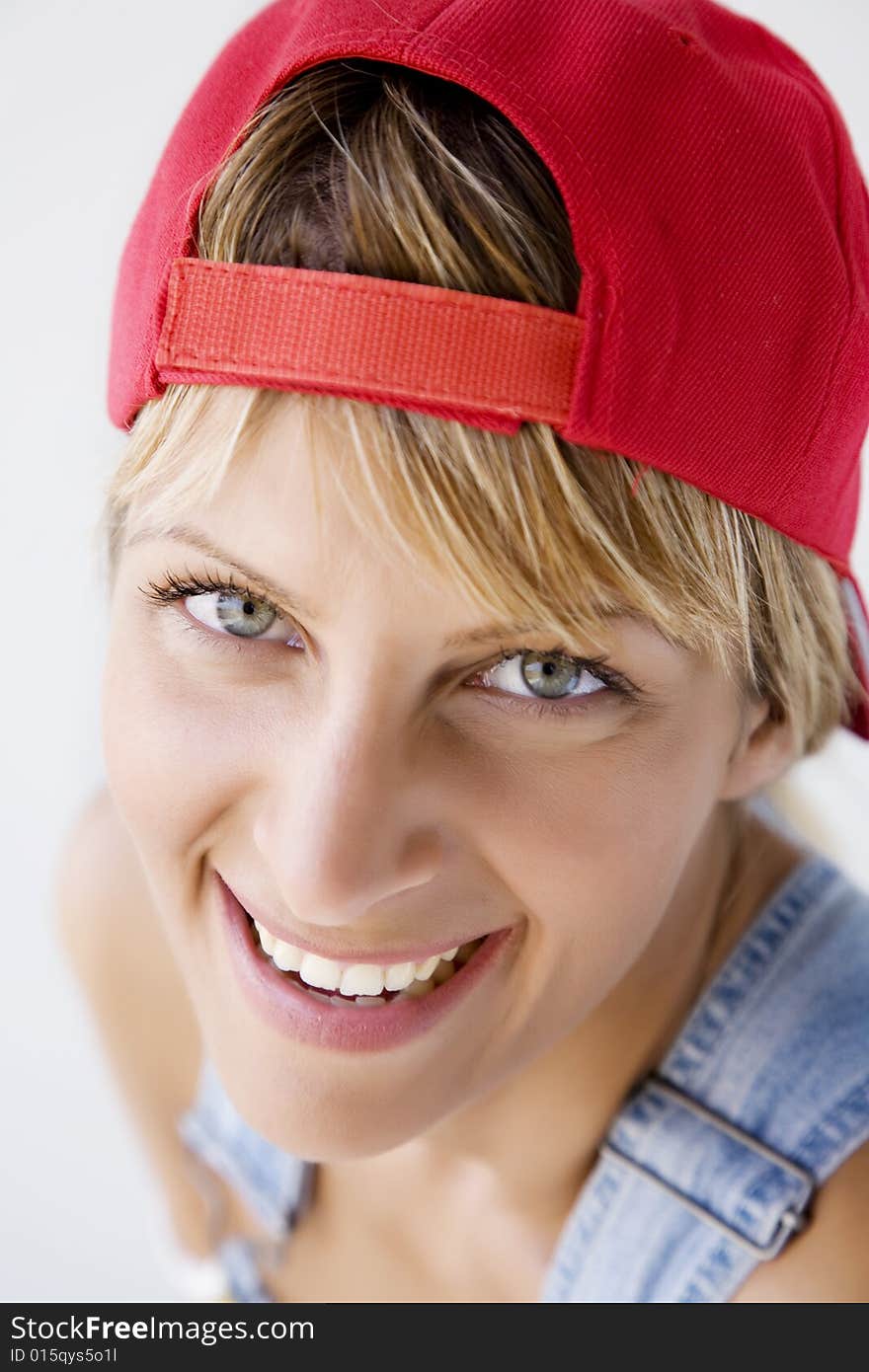 Closeup portrait of young woman with baseball cap. Closeup portrait of young woman with baseball cap