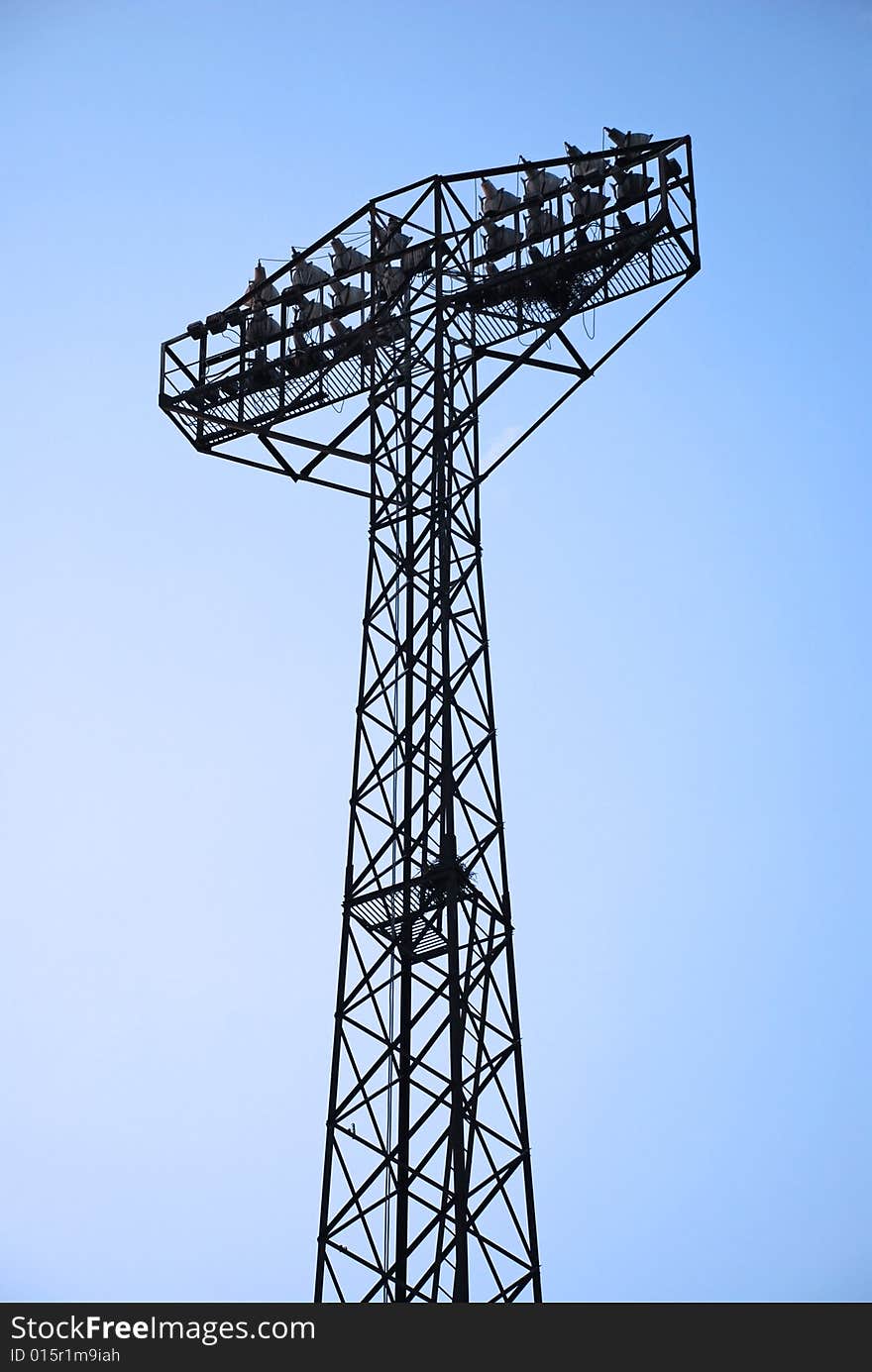 Stadium light pole at blue sky. Stadium light pole at blue sky