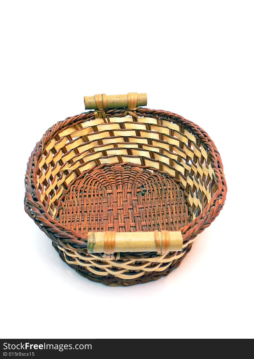 Close up of the wicker basket isolated on the white background.