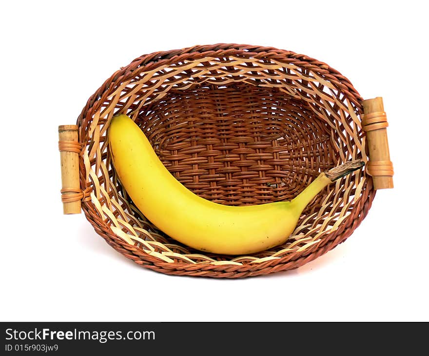 Banana in the wicker basket isolated on the white background. Banana in the wicker basket isolated on the white background.