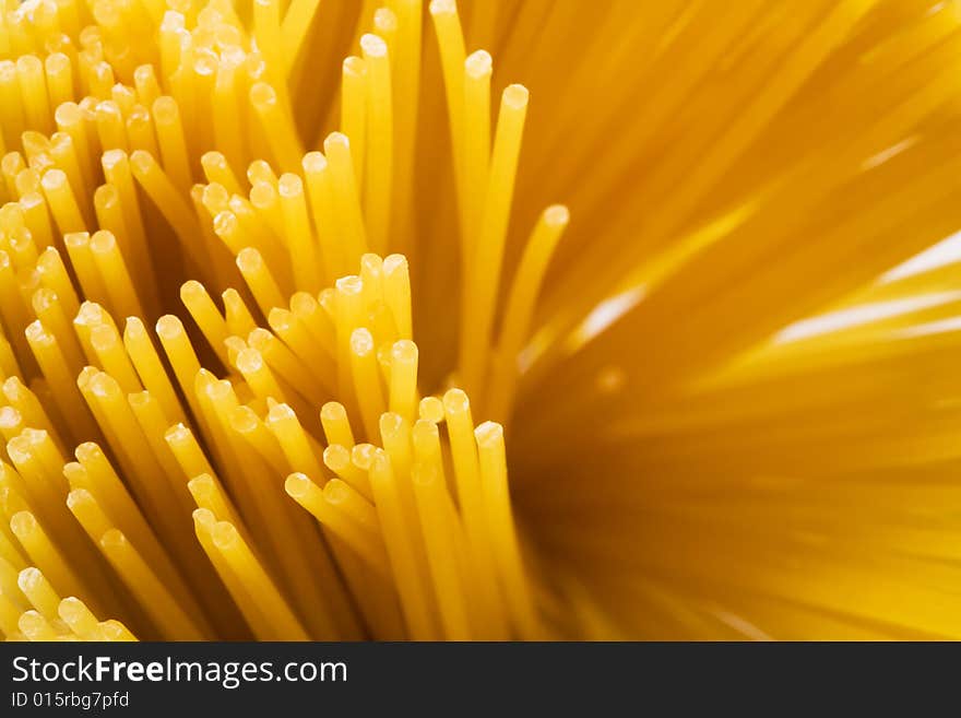 Yellow and beautiful pasta close-up as a background