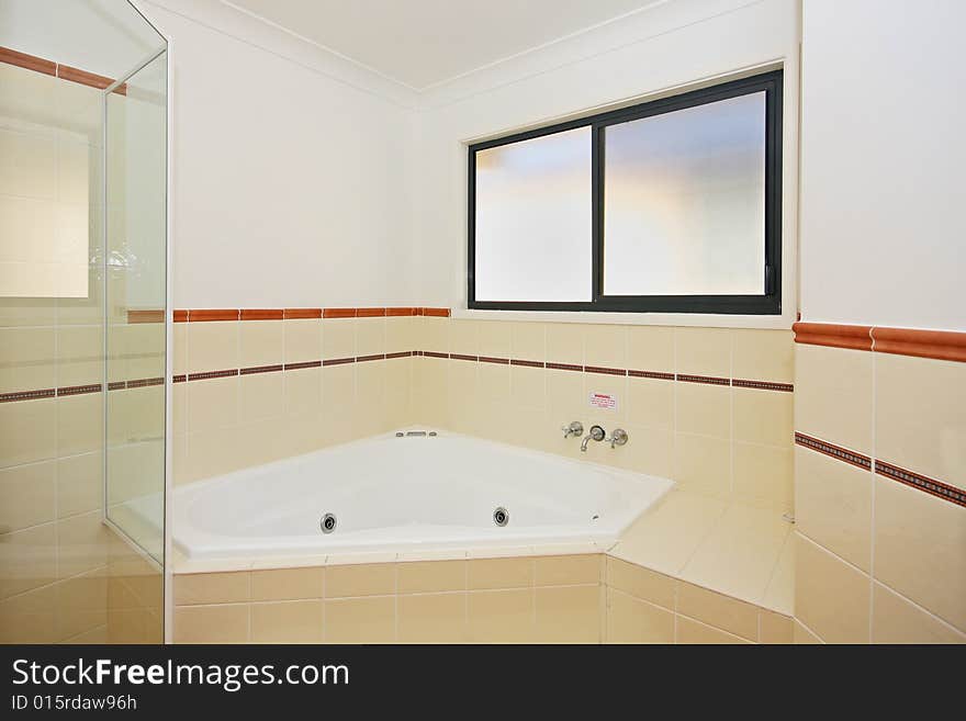 An interior photo of a modern bathroom. An interior photo of a modern bathroom