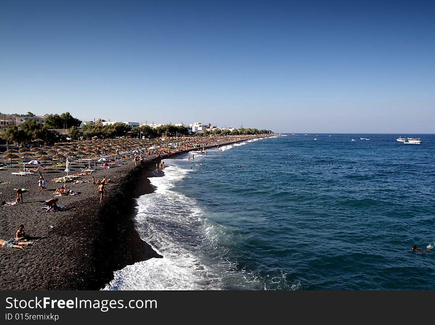 Beach full of with tourists in Santorini. Beach full of with tourists in Santorini