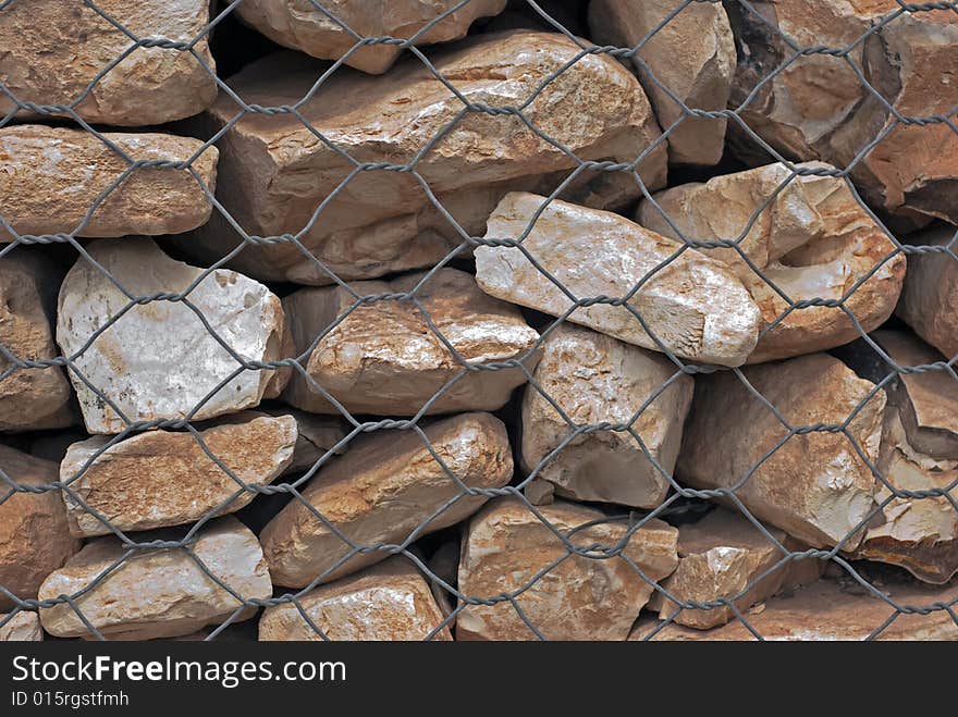 Stones under the metal net