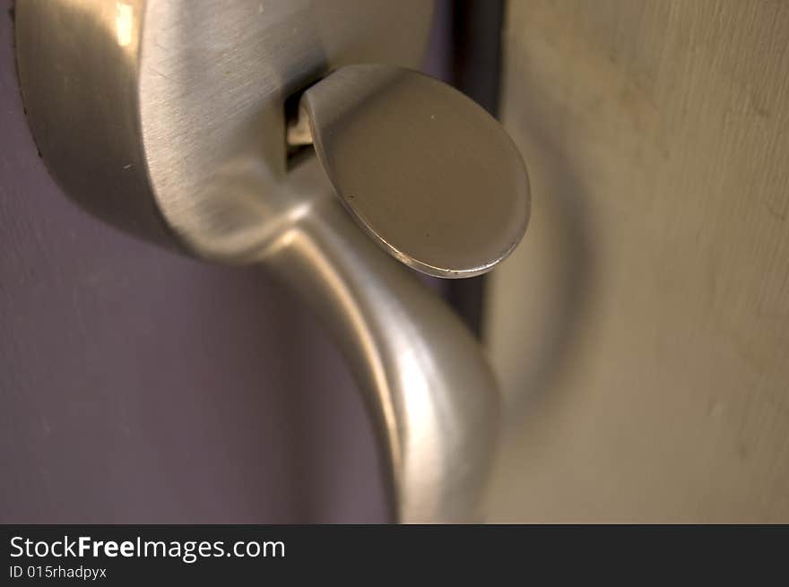 A photograph of a front door handle