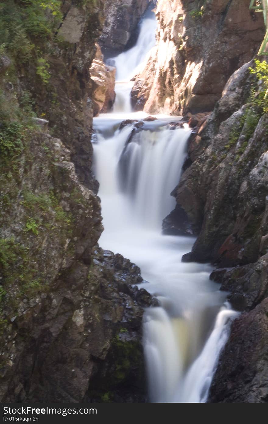 A waterfall crashes through several steps on its journey to the sea. A waterfall crashes through several steps on its journey to the sea.