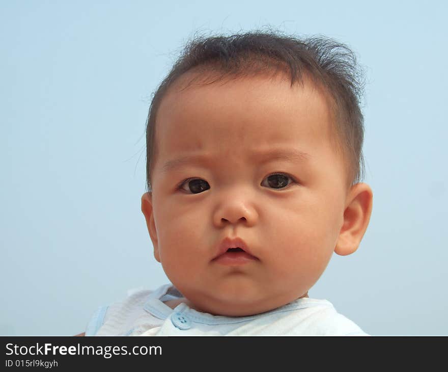 Lovely baby and blue sky on the roof. Lovely baby and blue sky on the roof