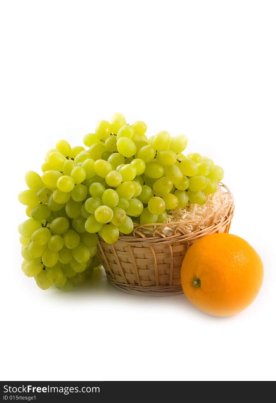 Basket With Green Grapes And Beautiful Ripe Orange